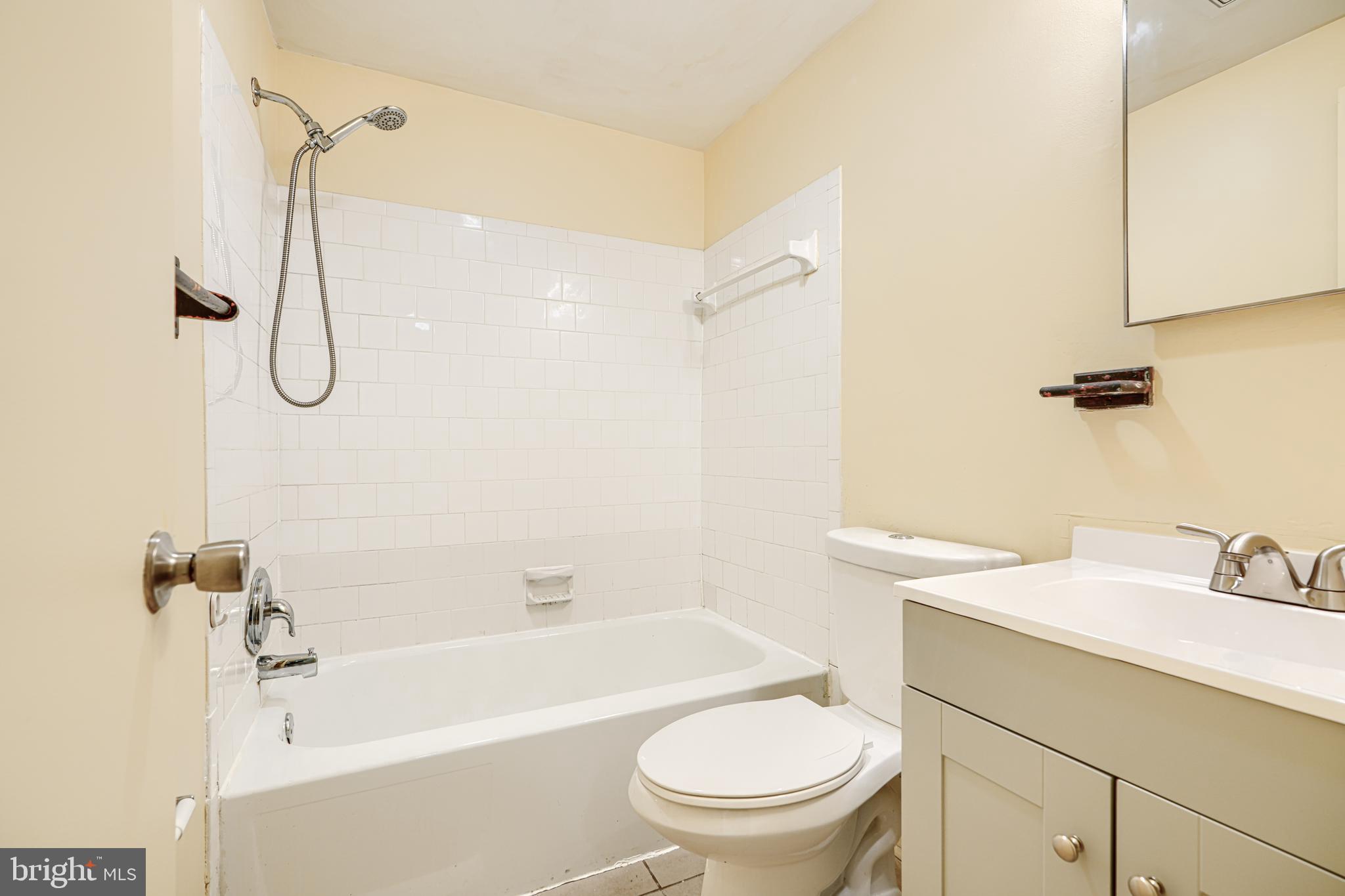 3 Slavin Court, Unit 2K Nottingham, MD 21236 - Photo 24 of 39 a bathroom with a sink toilet vanity and shower