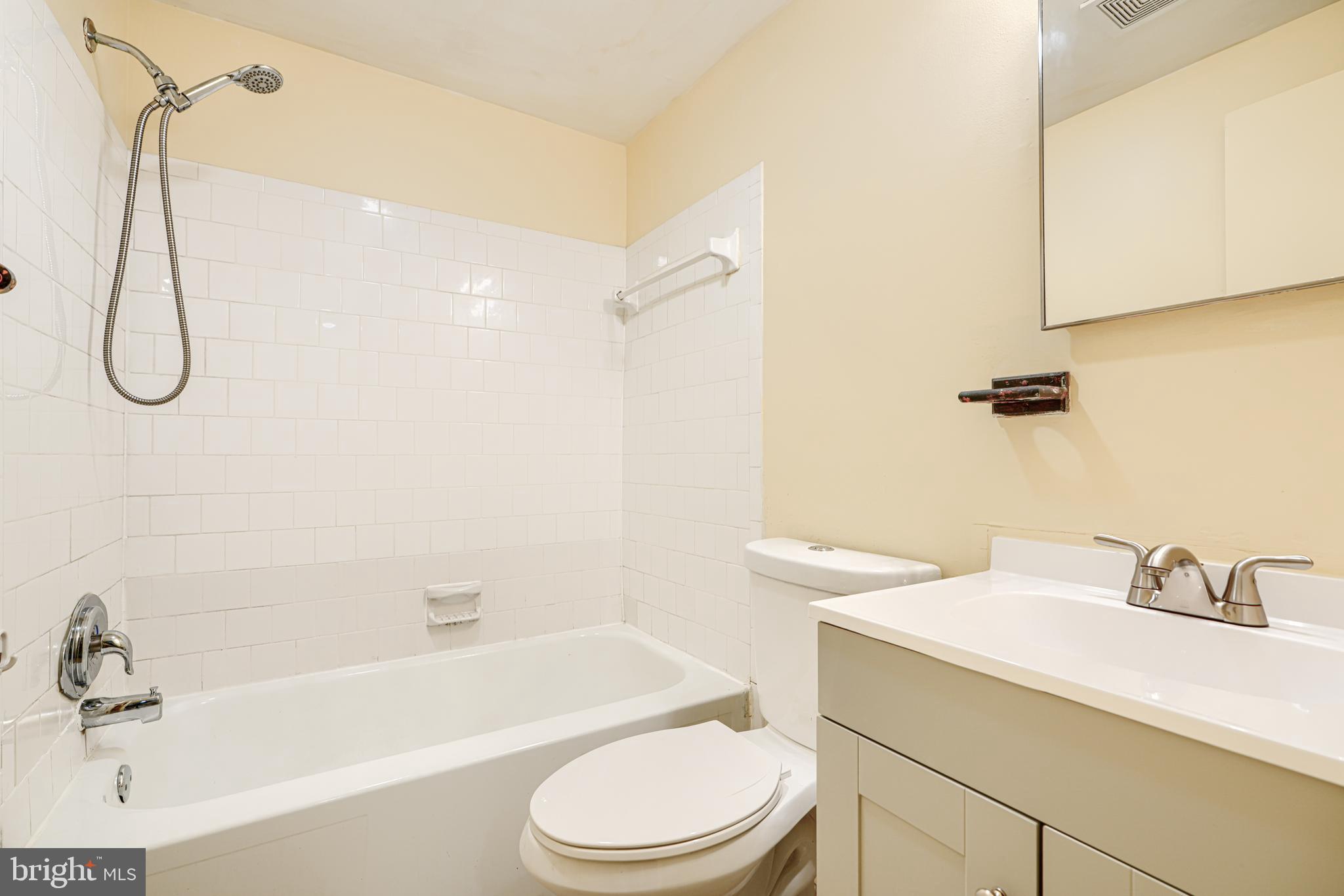 3 Slavin Court, Unit 2K Nottingham, MD 21236 - Photo 25 of 39 a bathroom with a sink a toilet and a bathtub