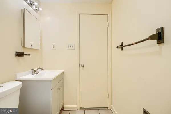 a bathroom with a sink and mirror