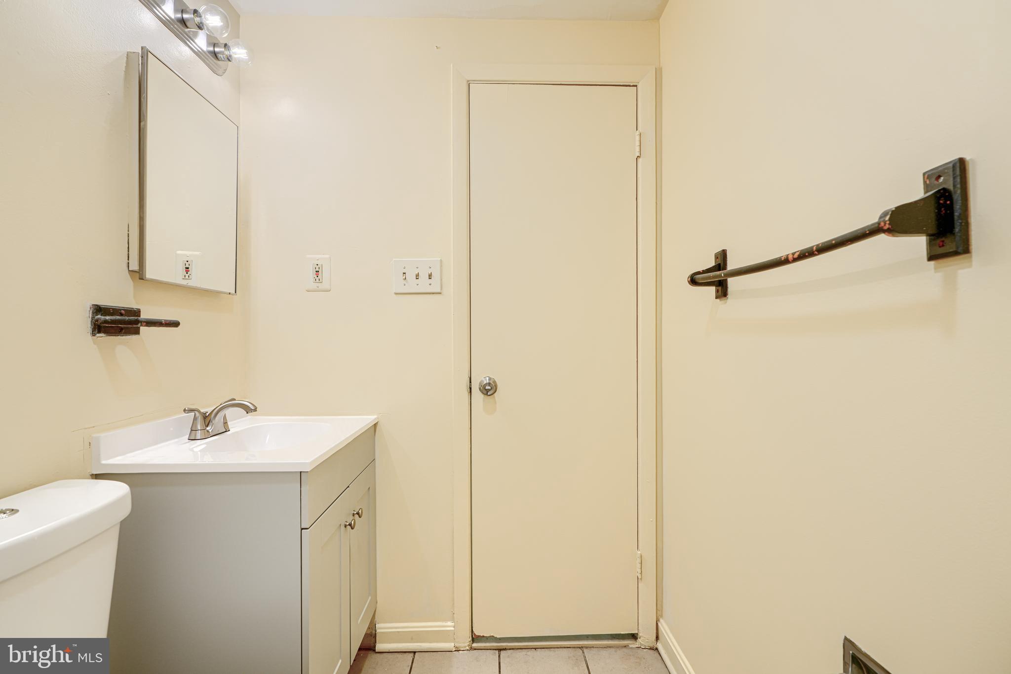 3 Slavin Court, Unit 2K Nottingham, MD 21236 - Photo 26 of 39 a bathroom with a sink and mirror