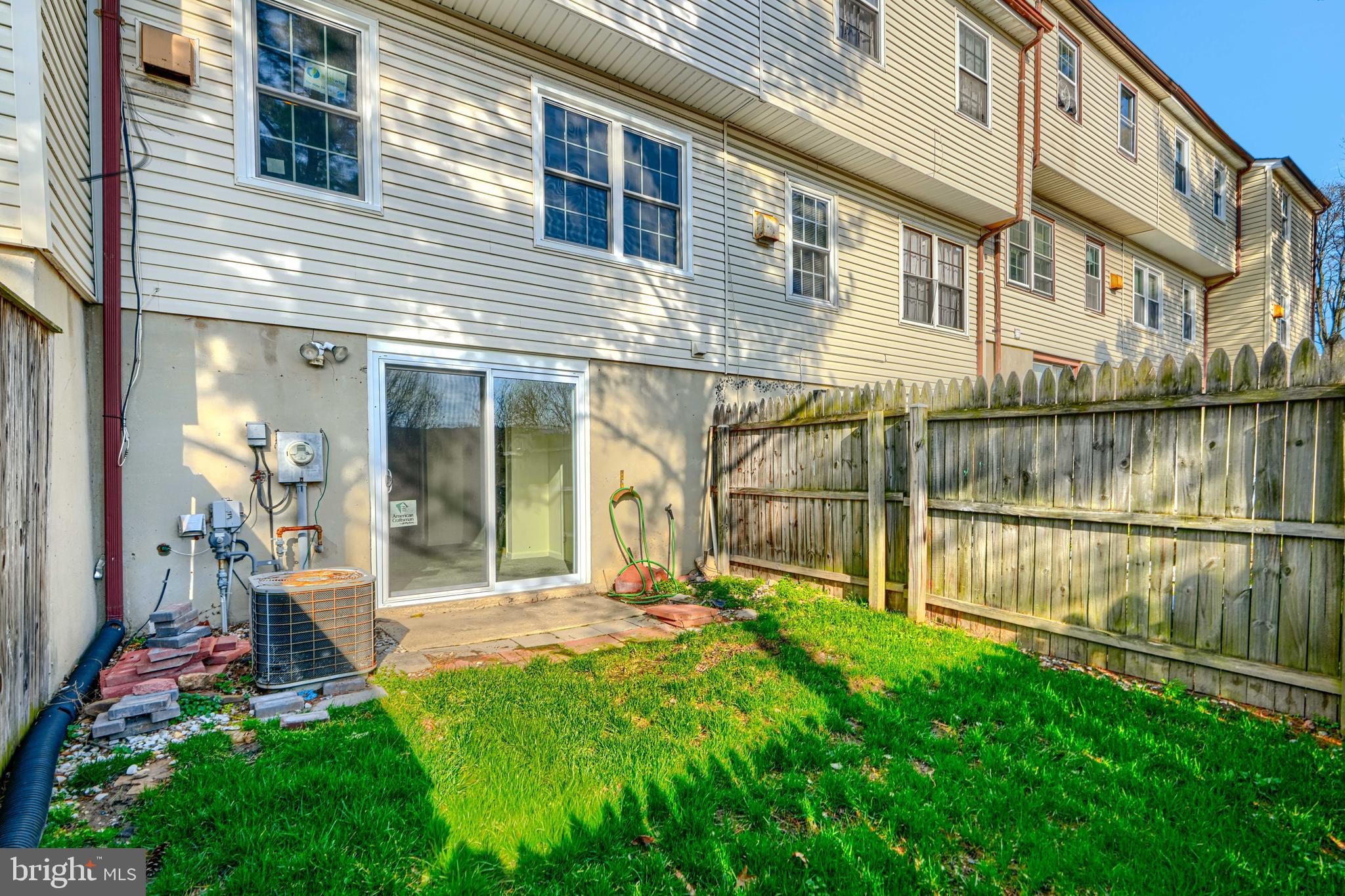 3 Slavin Court, Unit 2K Nottingham, MD 21236 - Photo 39 of 39 a view of a house with a yard and sitting area