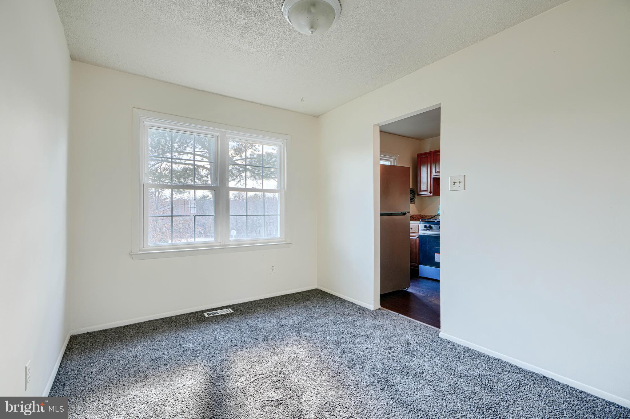 3 Slavin Court, Unit 2K Nottingham, MD 21236 - Photo 7 of 39 an empty room with windows