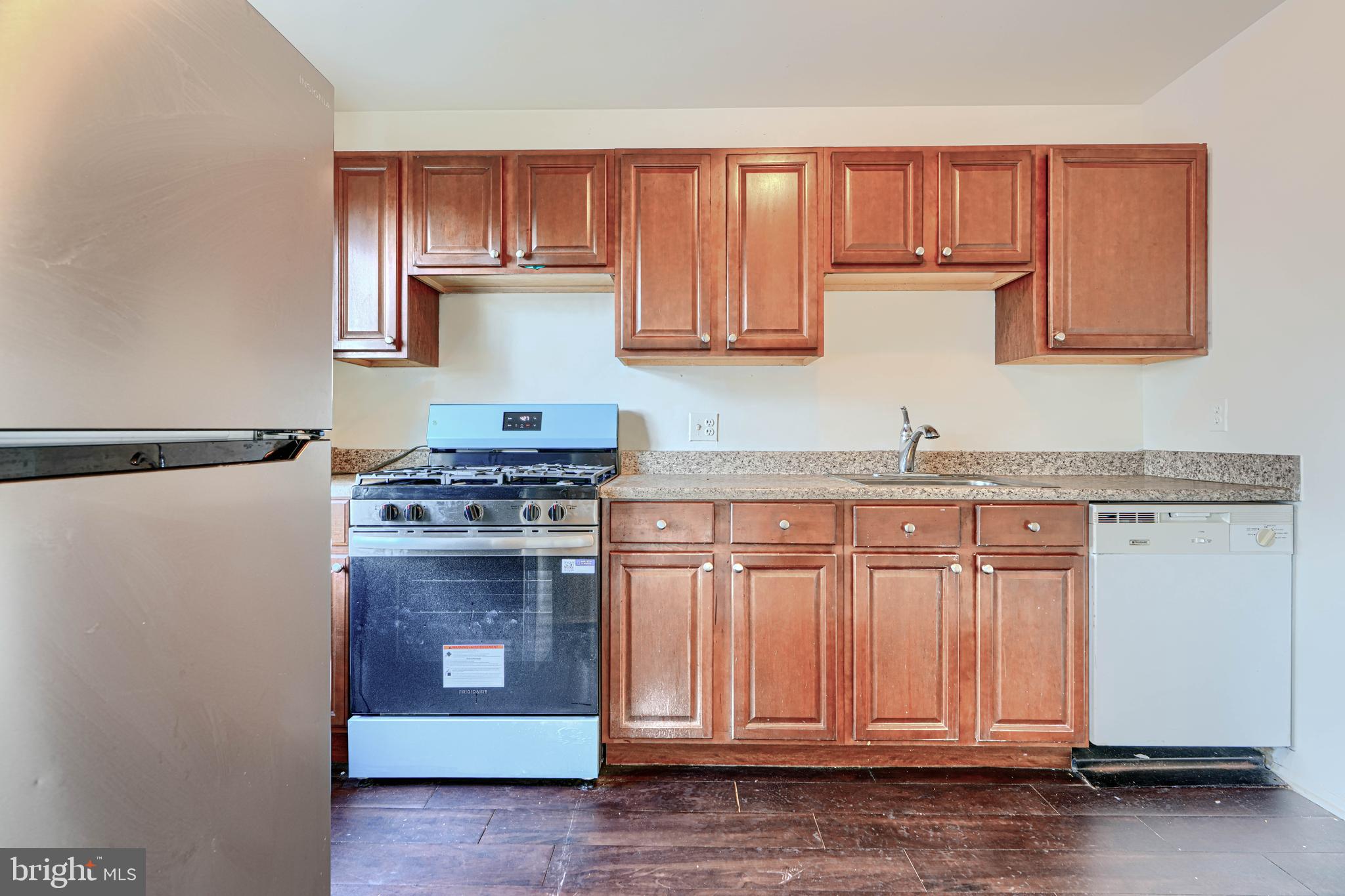 3 Slavin Court, Unit 2K Nottingham, MD 21236 - Photo 9 of 39 a kitchen with granite countertop cabinets and steel stainless steel appliances