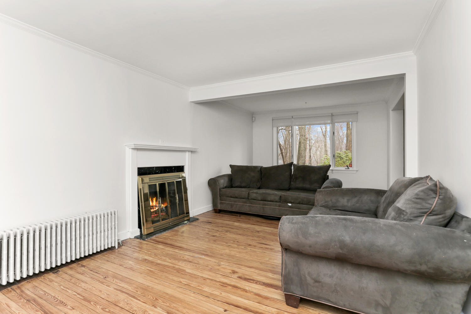 161 Spring Water Lane New Canaan, CT 06840 - Photo 6 of 9 a living room with furniture and a fireplace