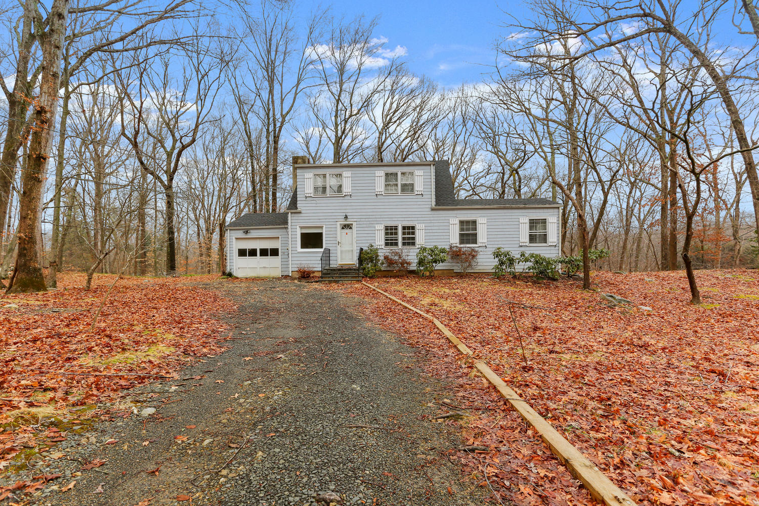 161 Spring Water Lane New Canaan, CT 06840 - Photo 9 of 9 a view of a white house with a snow on the road