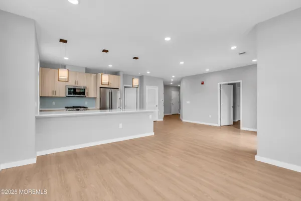 a view of kitchen with wooden floor
