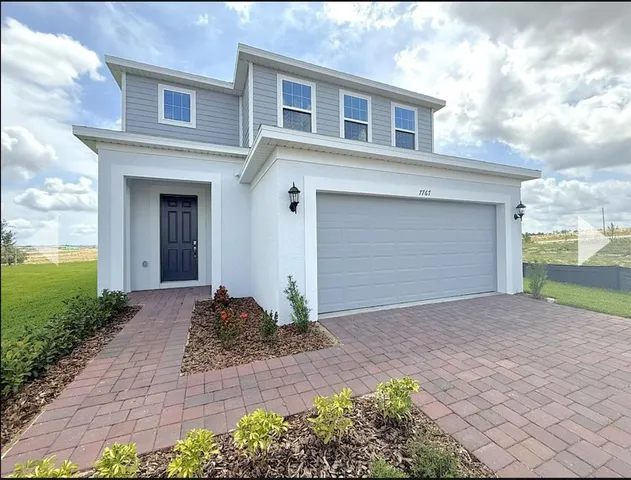 a front view of house with yard