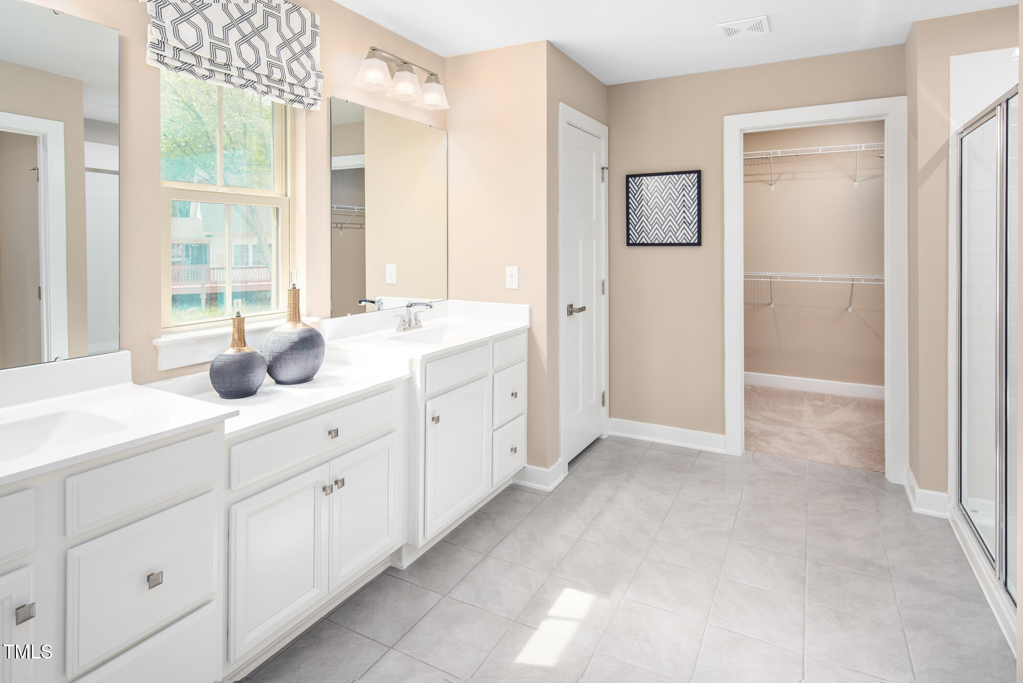 812 Walker Rdg Way Willow Spring, NC 27592 - Photo 19 of 23 a spacious bathroom with double vanity a mirror a double vanity and a shower