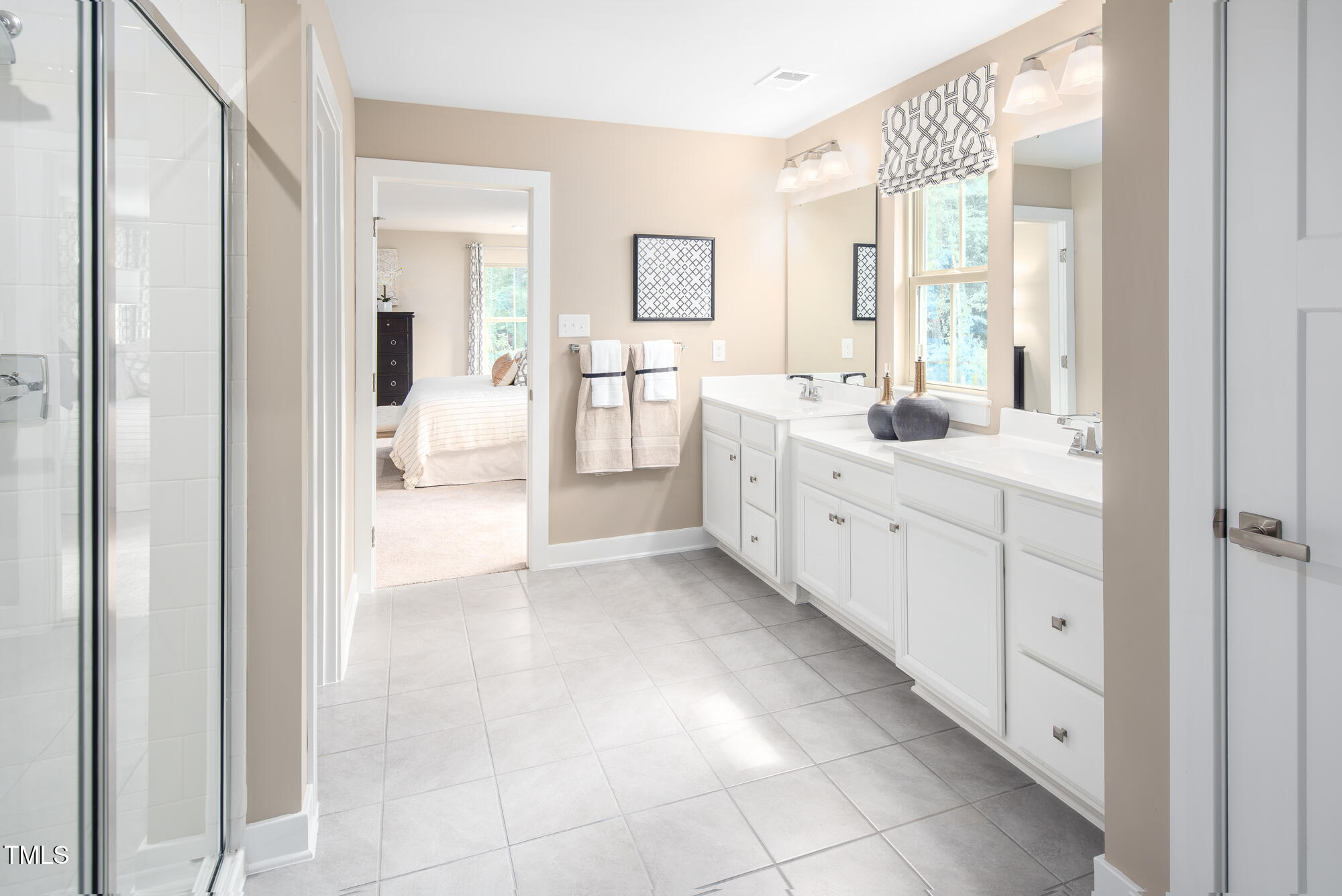 812 Walker Rdg Way Willow Spring, NC 27592 - Photo 20 of 23 a bathroom with a double vanity sink and mirror
