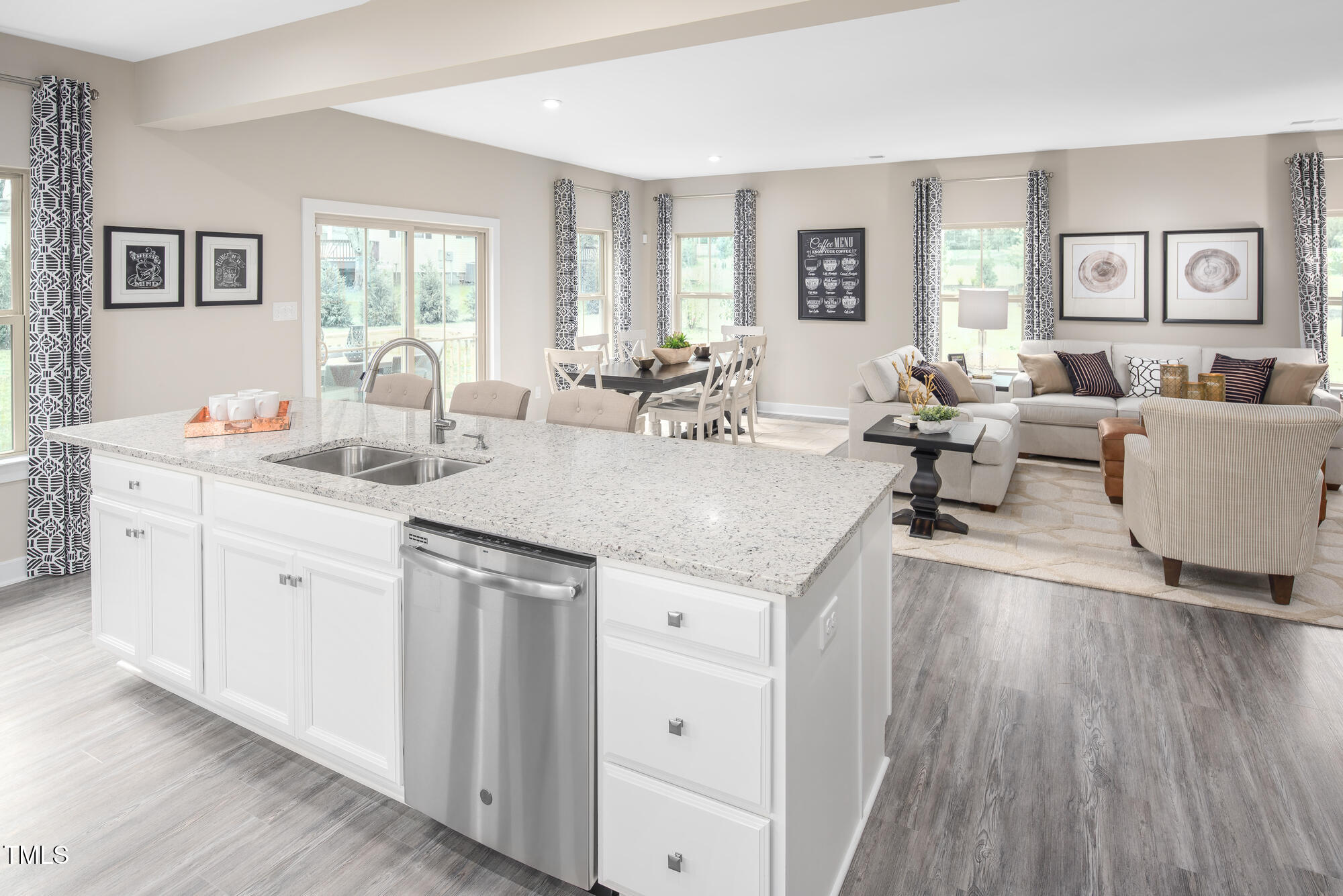 812 Walker Rdg Way Willow Spring, NC 27592 - Photo 5 of 23 a living room with stainless steel appliances granite countertop a sink and wooden floor