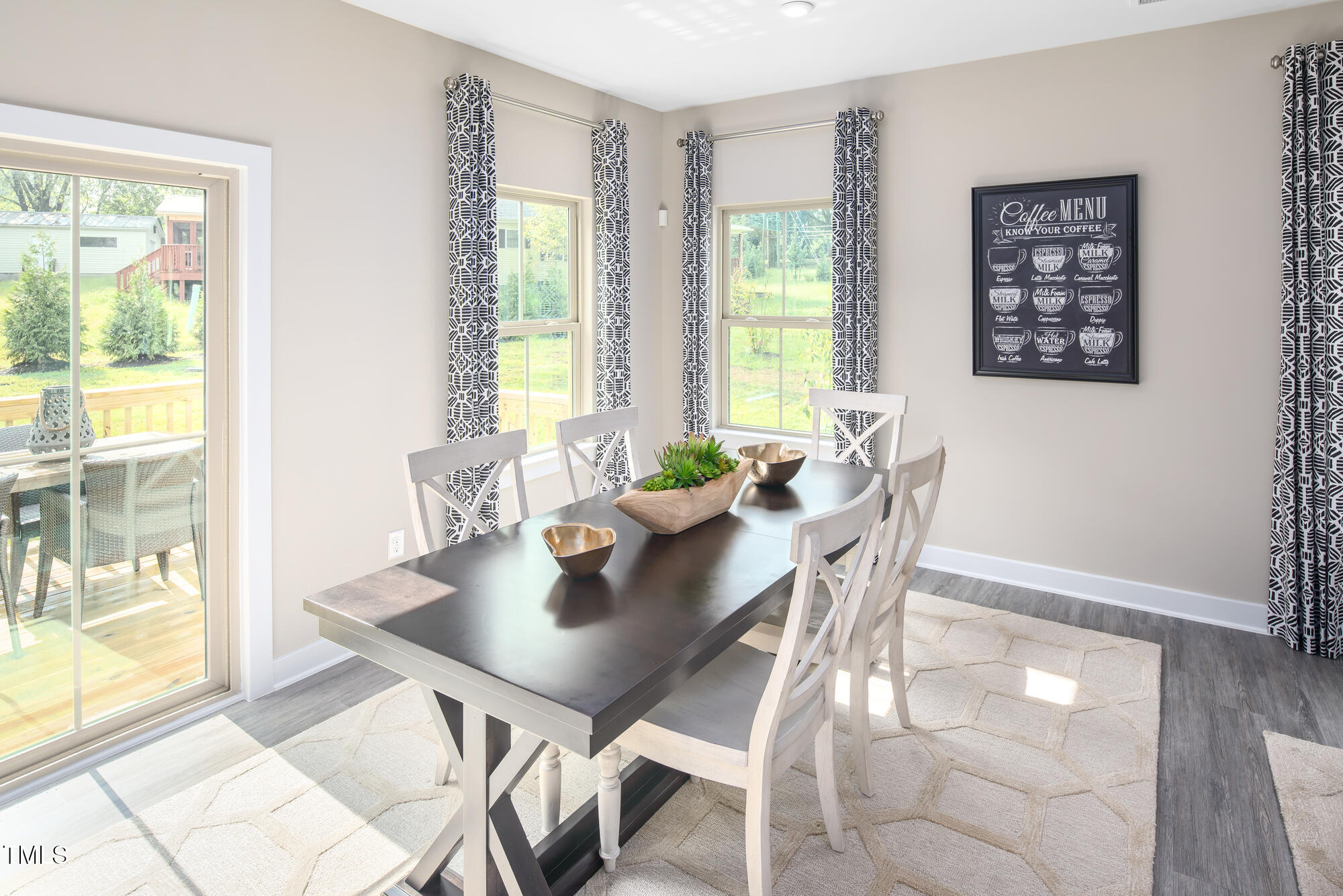 812 Walker Rdg Way Willow Spring, NC 27592 - Photo 8 of 23 a view of a dining room with furniture and wooden floor