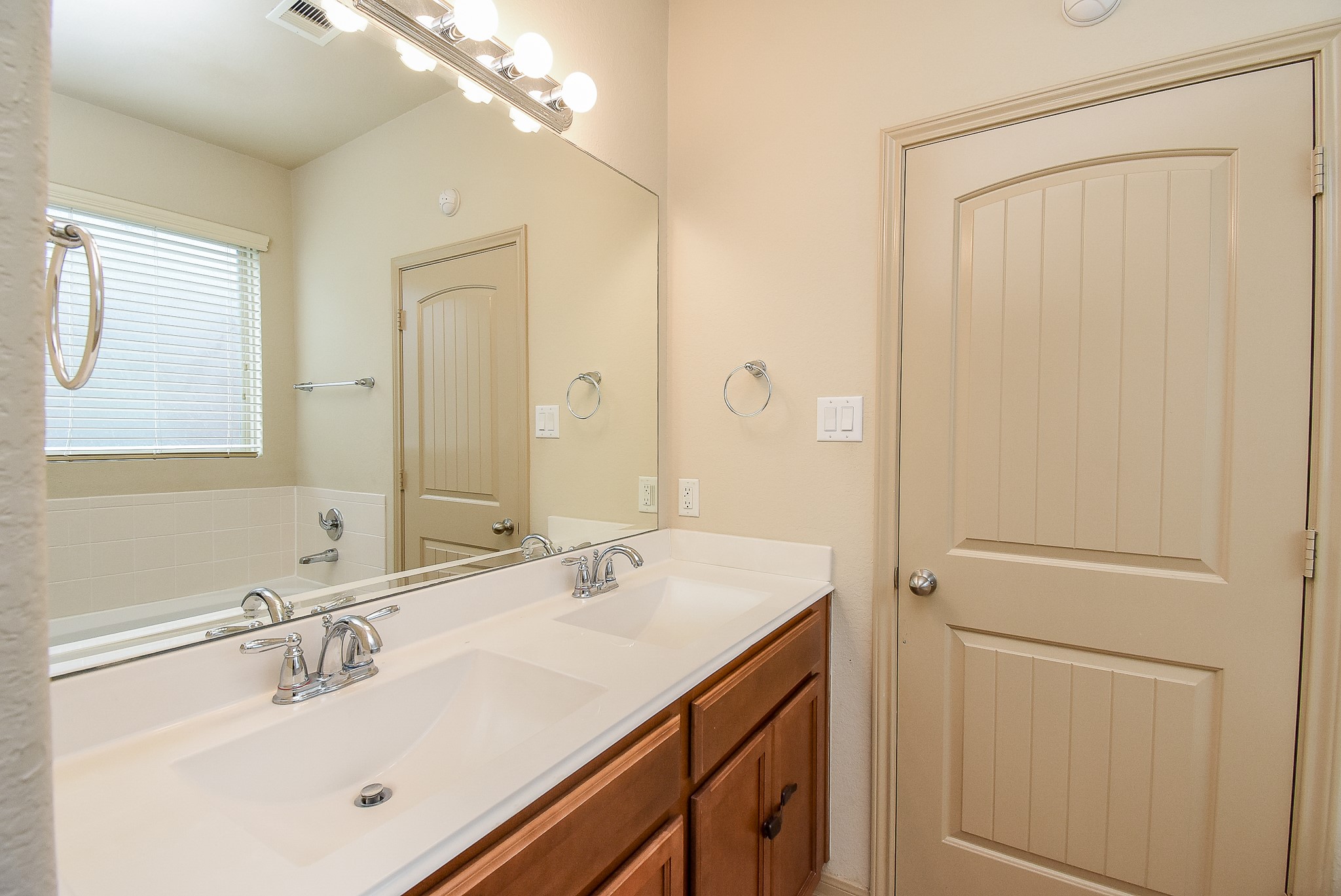 2106 Harmon Crest Court Spring, TX 77373 - Photo 17 of 32 a bathroom with a sink vanity and mirror