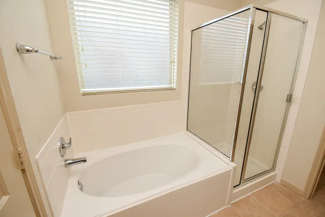 a white bath tub and shower