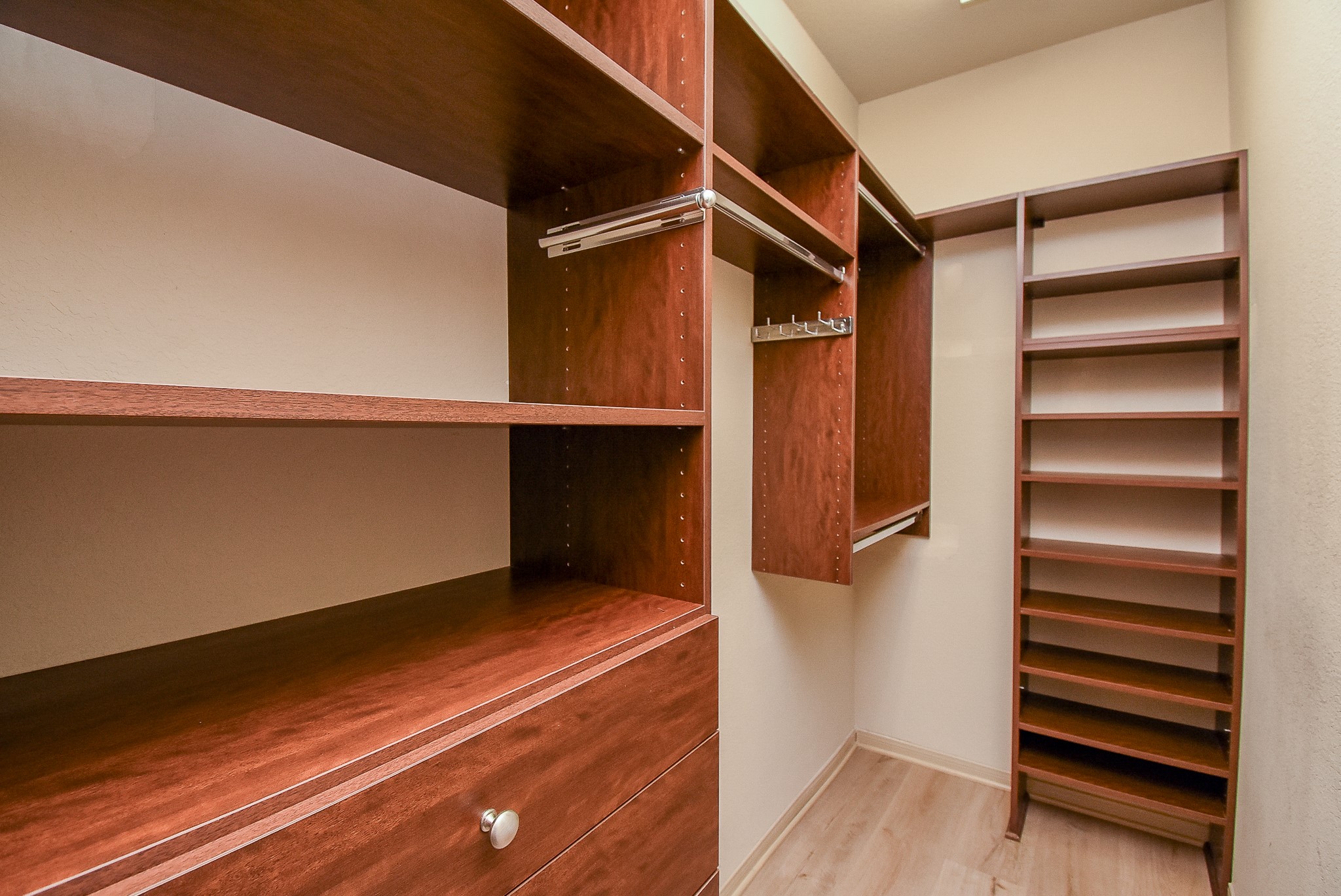 2106 Harmon Crest Court Spring, TX 77373 - Photo 19 of 32 a view of walk in closet with empty racks