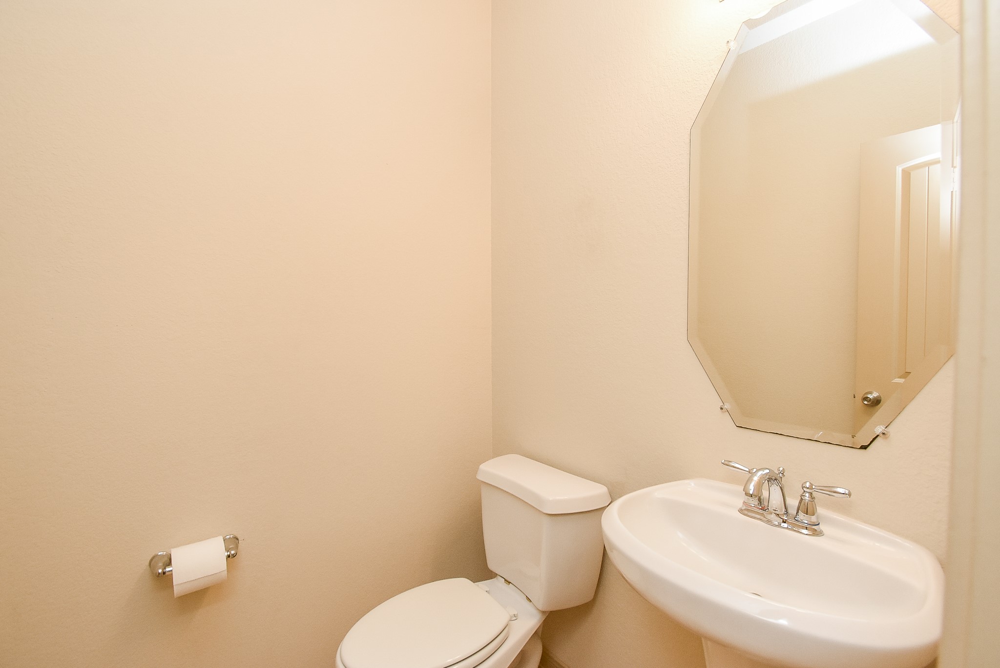 2106 Harmon Crest Court Spring, TX 77373 - Photo 29 of 32 a bathroom with a toilet a sink and mirror