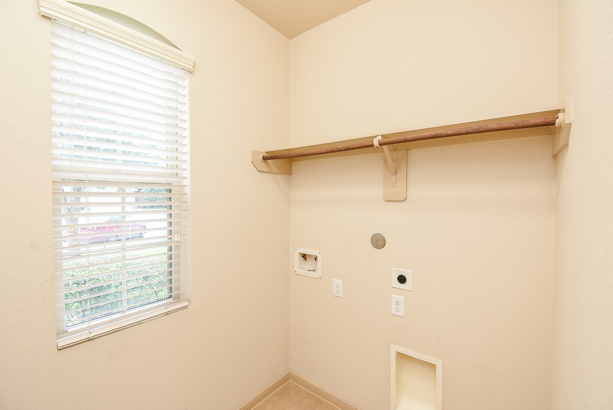 2106 Harmon Crest Court Spring, TX 77373 - Photo 30 of 32 a bathroom with a shower and a window
