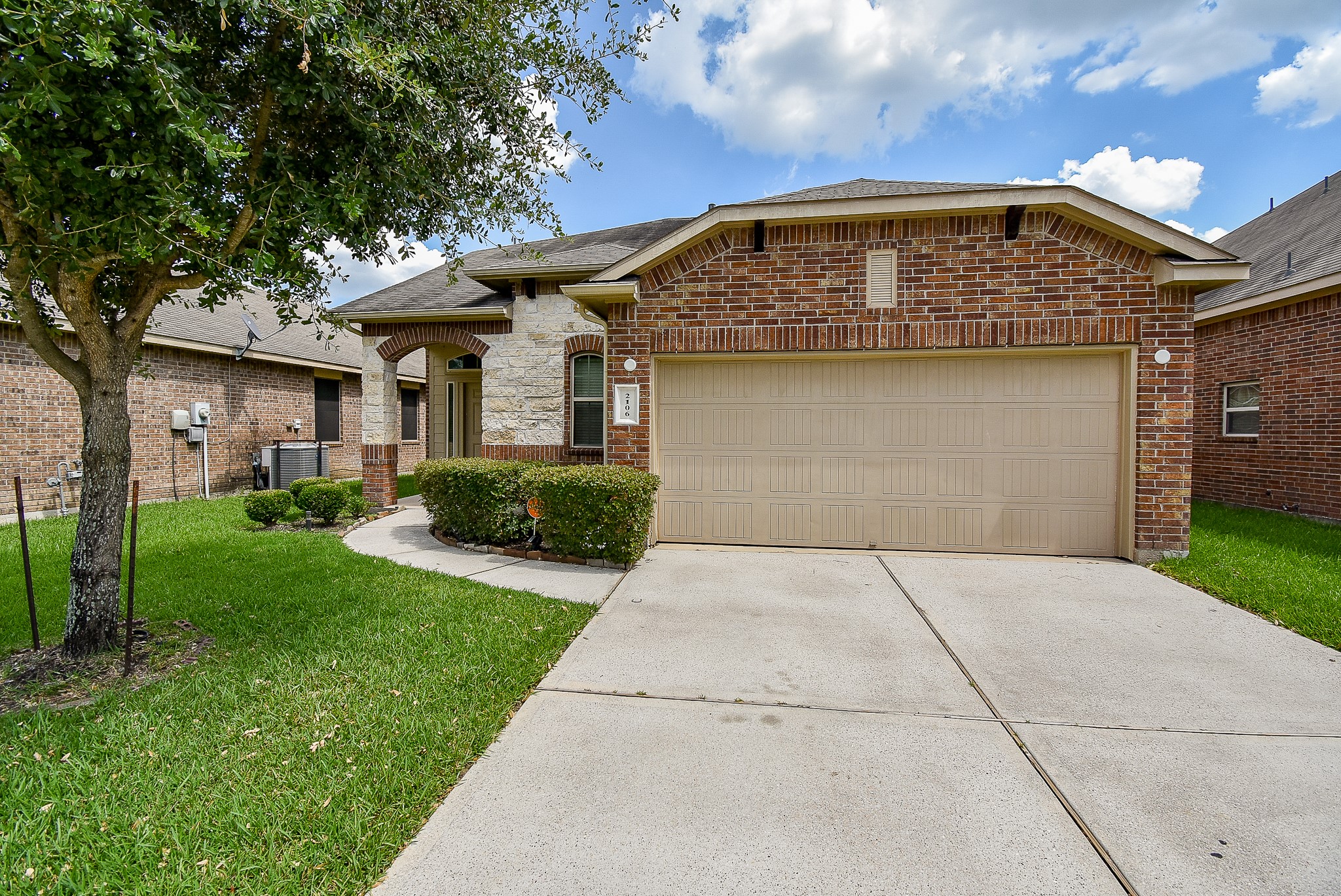 2106 Harmon Crest Court Spring, TX 77373 - Photo 3 of 32 a front view of a house with garden
