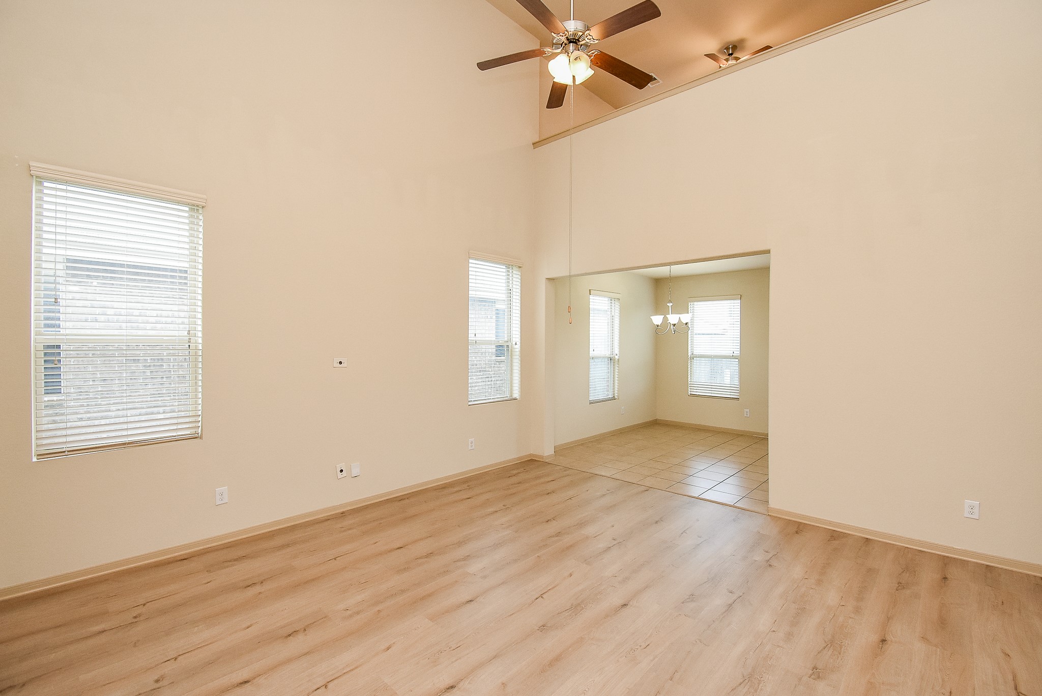 2106 Harmon Crest Court Spring, TX 77373 - Photo 8 of 32 an empty room with wooden floor fan and windows