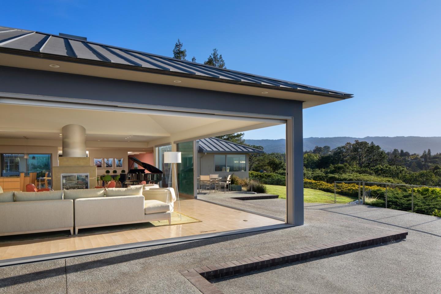 a view of a living room and a balcony