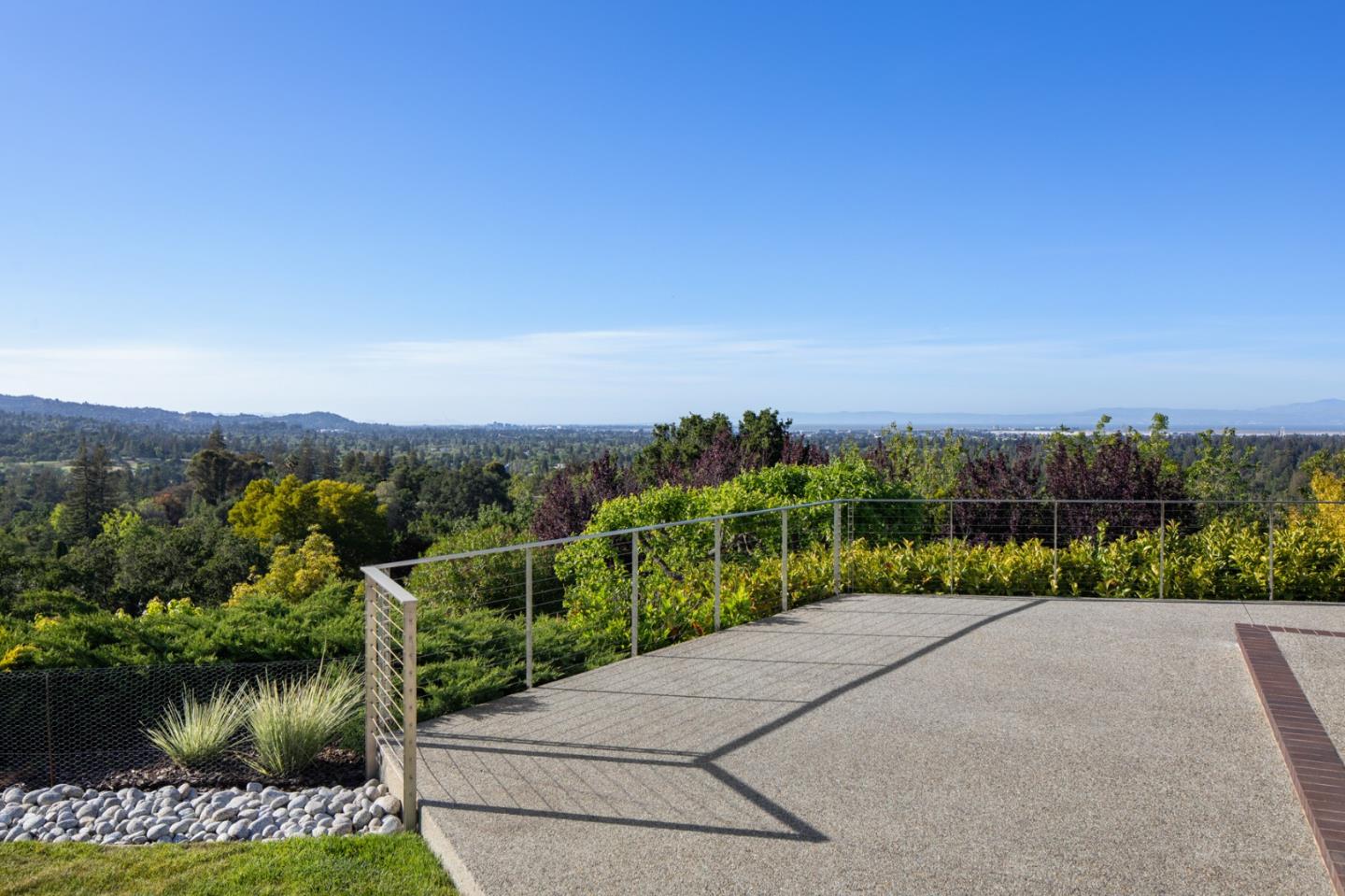 45 Melanie Lane Atherton, CA 94027 - Photo 2 of 4 a view of a garden with a building in the background