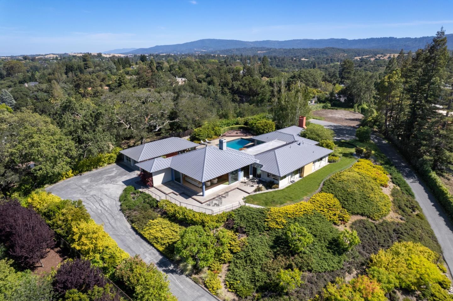 45 Melanie Lane Atherton, CA 94027 - Photo 4 of 4 an aerial view of residential houses with outdoor space and trees