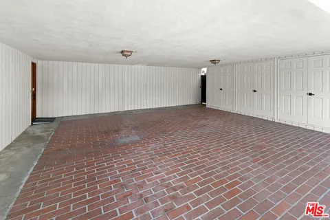 an aerial view of a house with yard swimming pool and outdoor seating