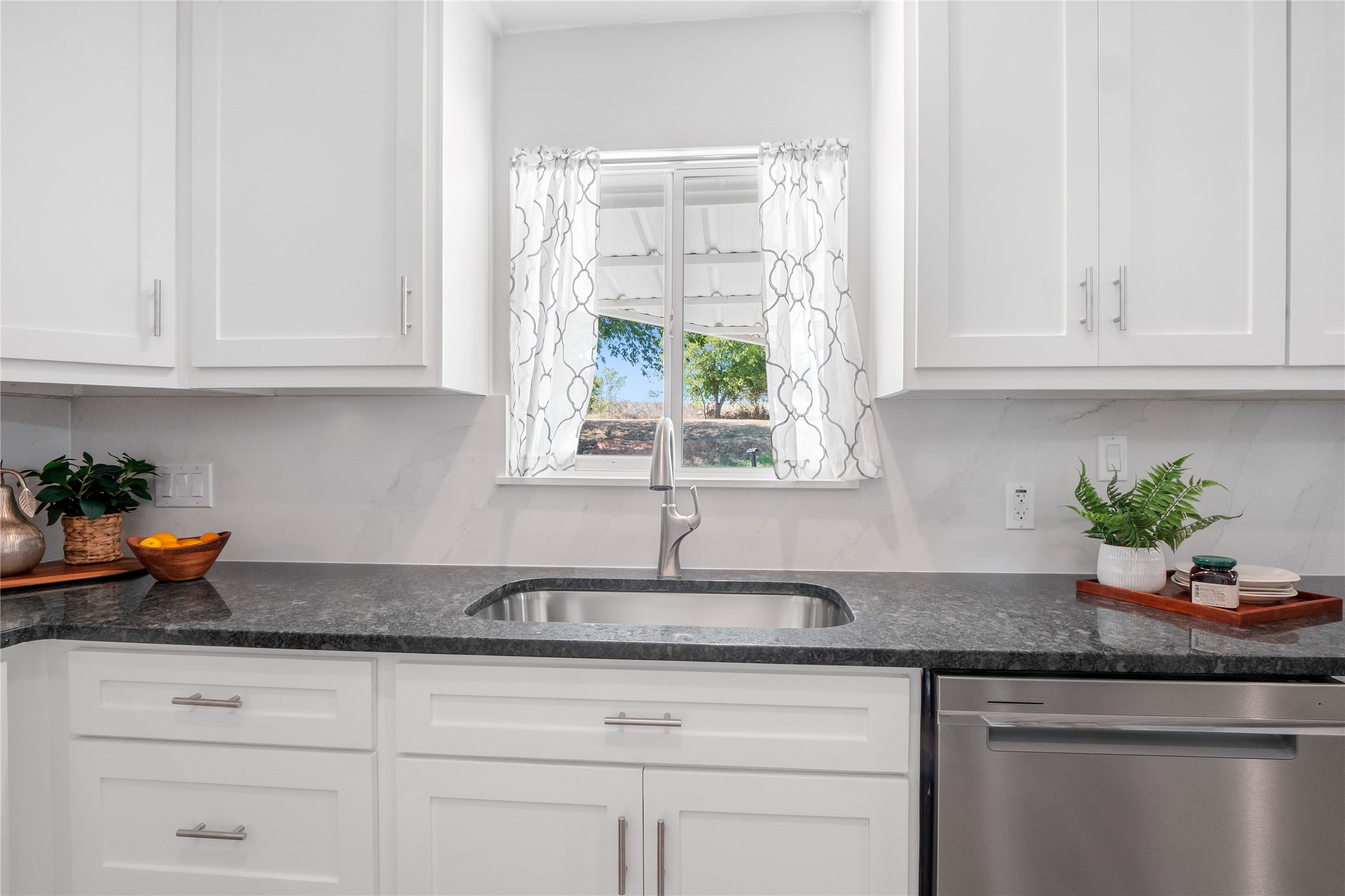 8007 Colony Loop Drive Austin, TX 78724 - Photo 35 of 40 Farmhouse sink with window view for natural light and everyday practicality.