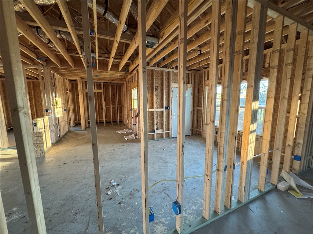 331 Rogers Street Rogers, TX 76569 - Photo 5 of 11 a view of a hallway with wooden shelves