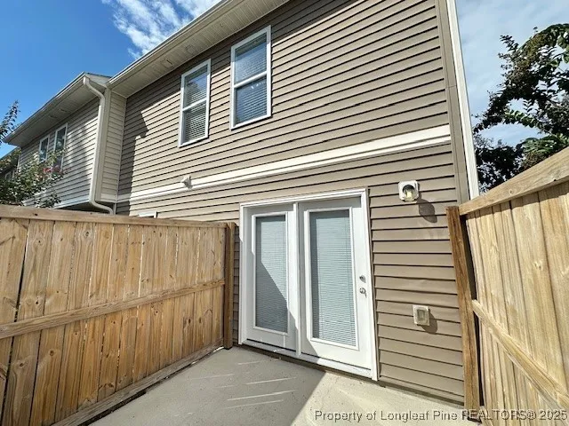 a view of a house with a door and wooden floor