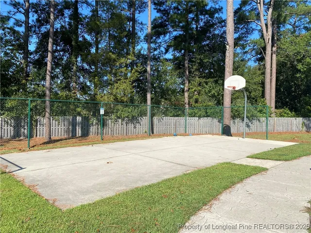 a view of a house with basketball court