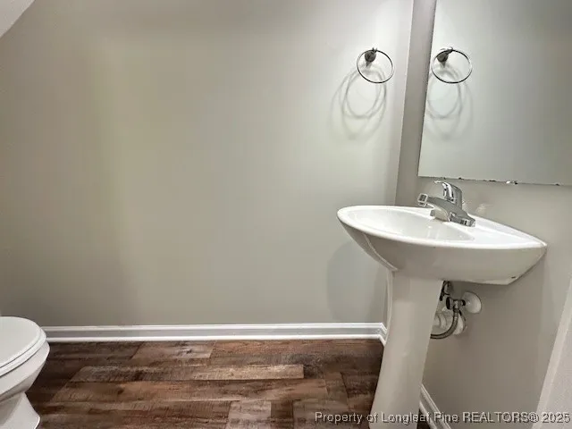 a bathroom with a sink toilet