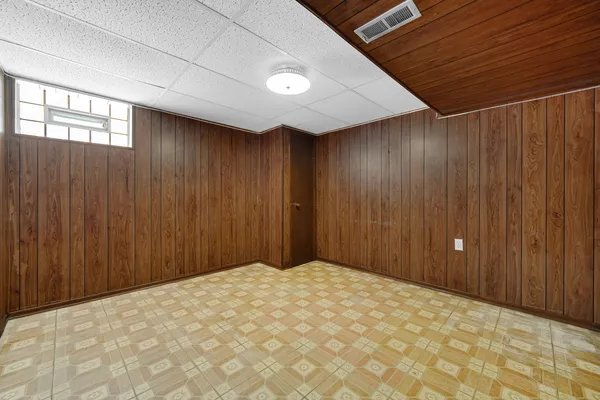 a view of a big room with a wooden walls