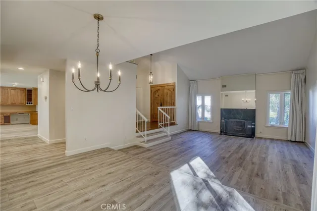 a view of a livingroom with wooden floor