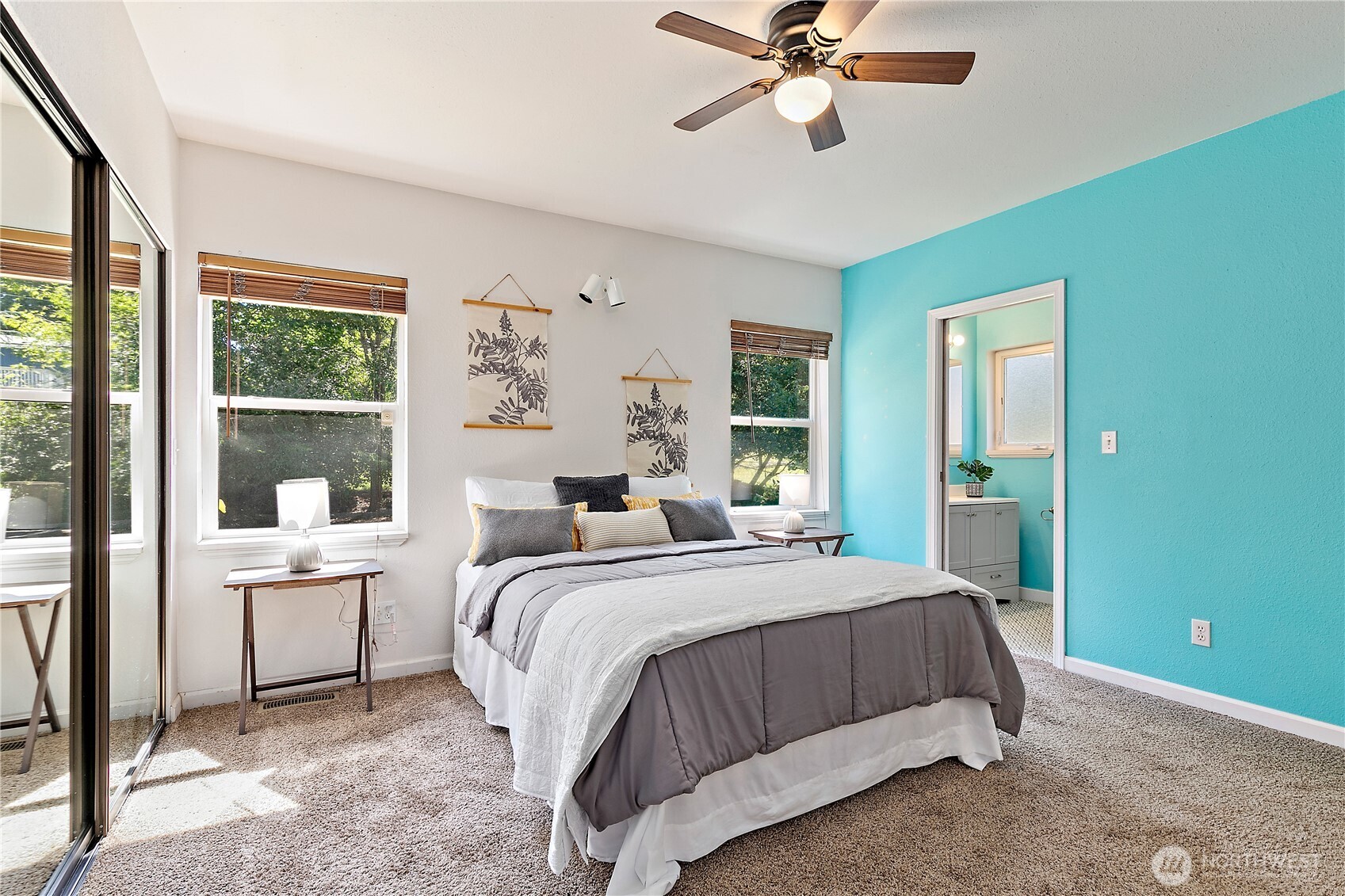 9880 Fredrickson Road Northwest Bremerton, WA 98311 - Photo 15 of 28 a bedroom with a large bed and a window