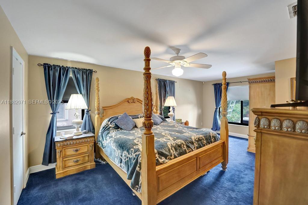 3187 Beechberry Circle Davie, FL 33328 - Photo 18 of 20 a bed room with bed and a tv