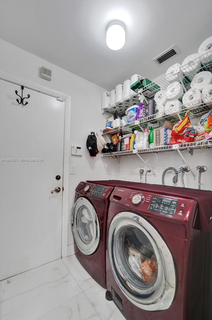 3187 Beechberry Circle Davie, FL 33328 - Photo 20 of 20 a utility room with dryer and washer