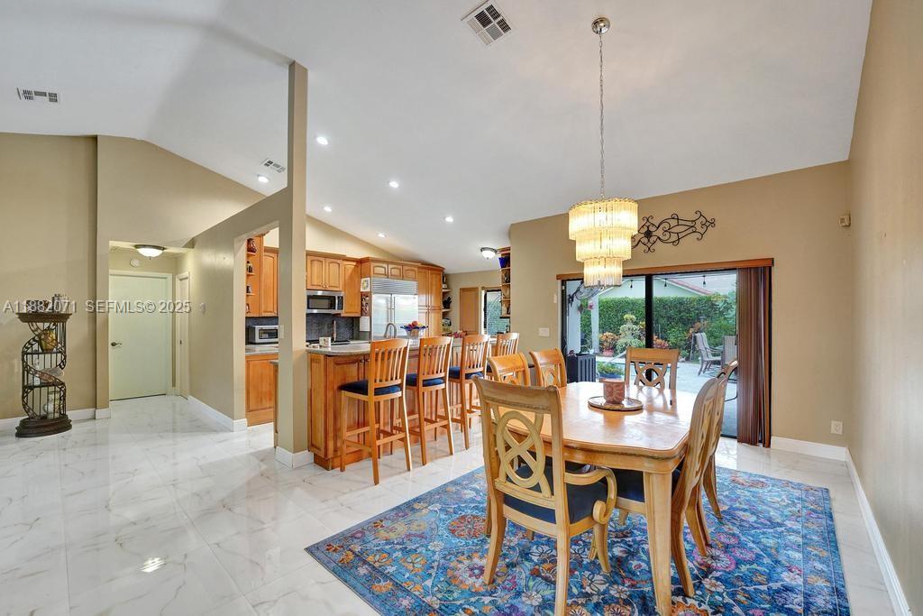 3187 Beechberry Circle Davie, FL 33328 - Photo 9 of 20 a view of a dining room with furniture window and outside view