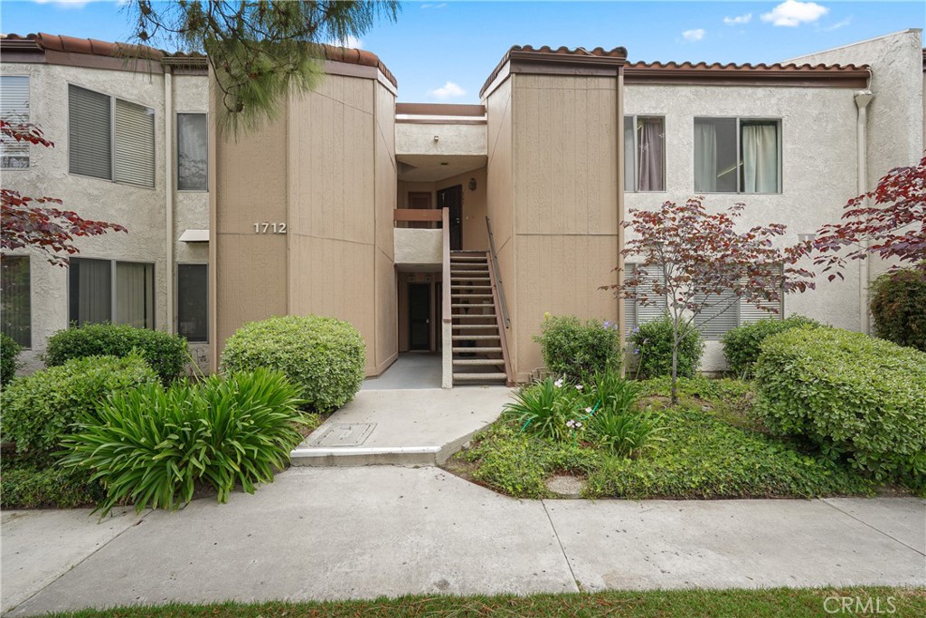 1712 Sinaloa Road, Unit 203 Simi Valley, CA 93065 - Photo 1 of 1 a view of a house with a yard