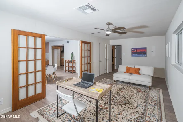 a view of a living room with a baby crib