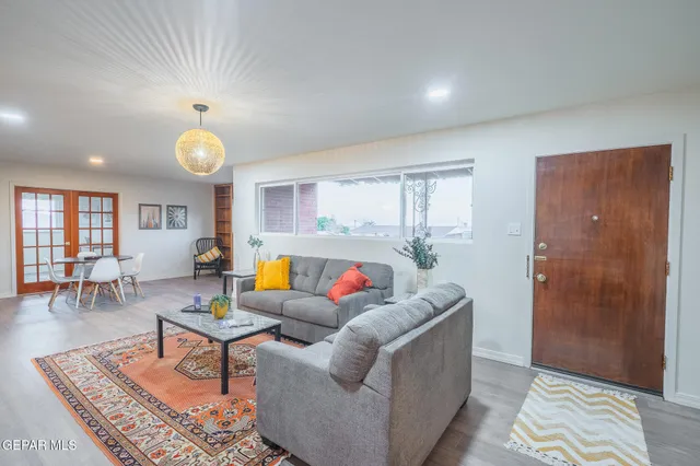 a living room with furniture and a table