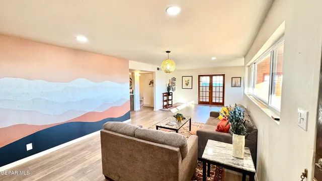 a view of a room with shelves on the wall