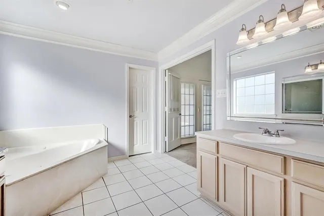 a bathroom with a sink a vanity and a mirror