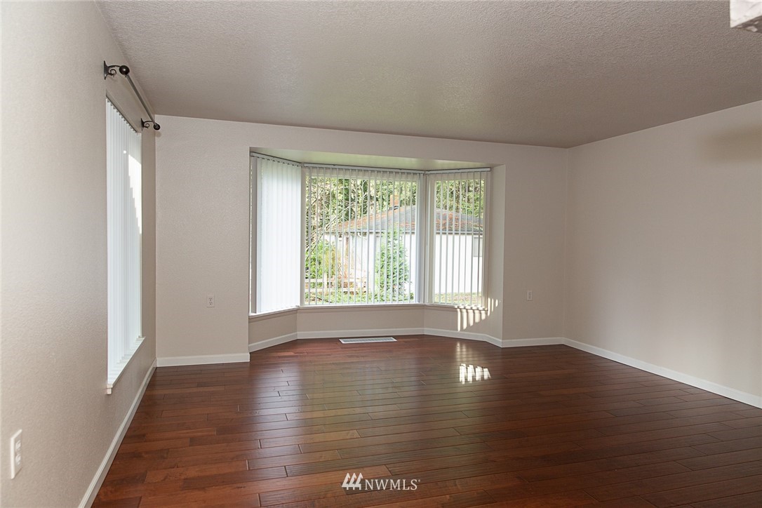 23605 5th Avenue West Bothell, WA 98021 - Photo 13 of 20 a view of empty room with wooden floor and fan