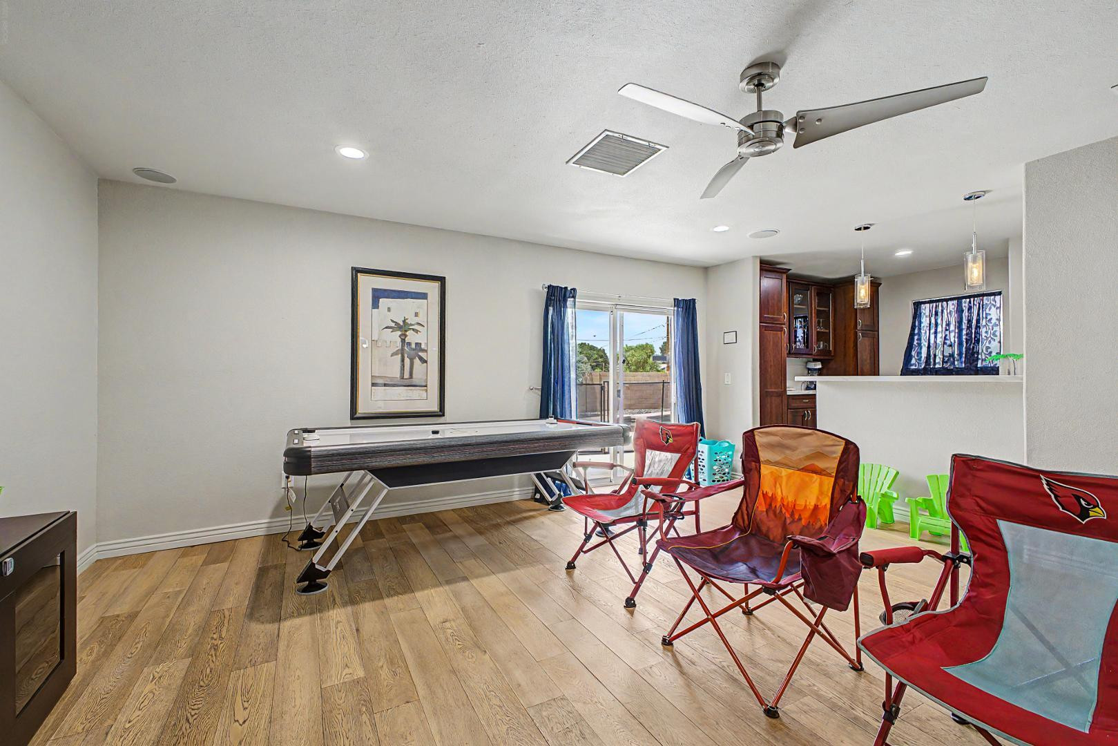 3346 East Cochise Road Phoenix, AZ 85028 - Photo 5 of 40 a living room with furniture a rug and a flat screen tv