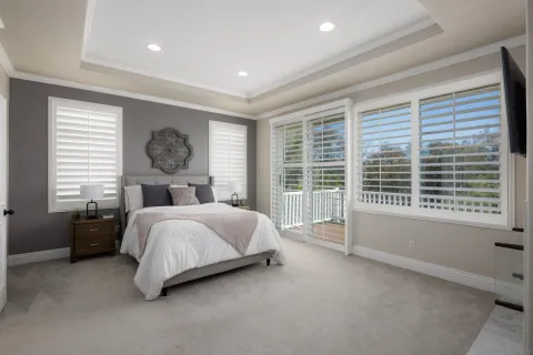 a bedroom with a bed and a fireplace