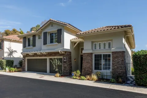 a front view of a house with a garage