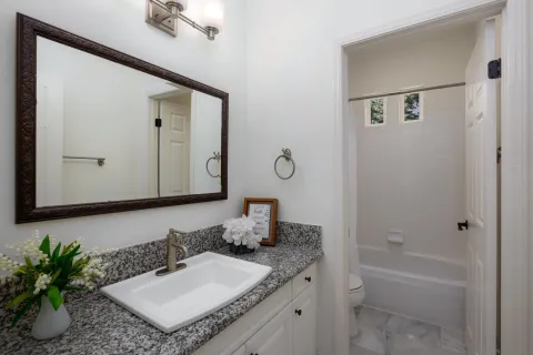 a bathroom with a sink and a window