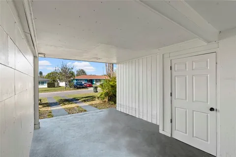 a view of a two room with large windows