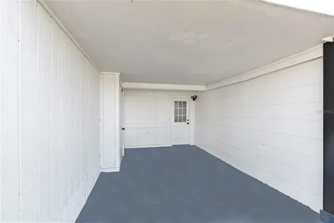 a view of a big room with closet and windows