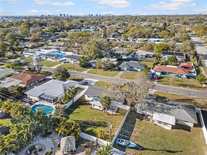 an aerial view of residential houses with outdoor space